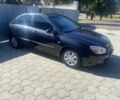 Чорний Кіа Черато, об'ємом двигуна 1.6 л та пробігом 284 тис. км за 3100 $, фото 1 на Automoto.ua