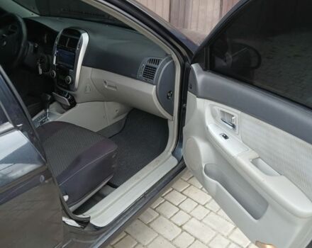 Черный Киа Черато, объемом двигателя 2 л и пробегом 250 тыс. км за 3700 $, фото 11 на Automoto.ua