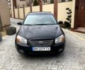 Черный Киа Черато, объемом двигателя 2 л и пробегом 357 тыс. км за 3200 $, фото 1 на Automoto.ua