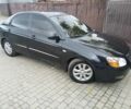 Черный Киа Черато, объемом двигателя 2 л и пробегом 250 тыс. км за 3700 $, фото 1 на Automoto.ua