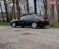 Черный Киа Черато, объемом двигателя 1.59 л и пробегом 302 тыс. км за 3700 $, фото 1 на Automoto.ua