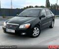 Черный Киа Черато, объемом двигателя 1.6 л и пробегом 210 тыс. км за 4000 $, фото 1 на Automoto.ua