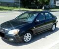 Черный Киа Черато, объемом двигателя 2 л и пробегом 220 тыс. км за 4600 $, фото 1 на Automoto.ua