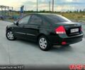 Черный Киа Черато, объемом двигателя 1.6 л и пробегом 210 тыс. км за 4000 $, фото 5 на Automoto.ua
