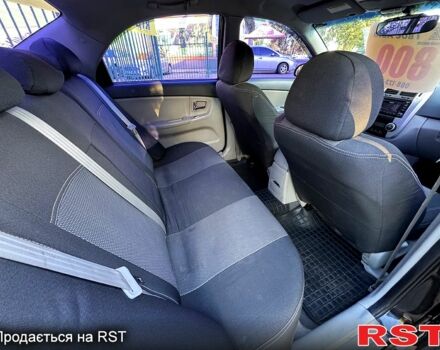 Черный Киа Черато, объемом двигателя 1.6 л и пробегом 174 тыс. км за 4550 $, фото 5 на Automoto.ua