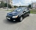 Черный Киа Черато, объемом двигателя 1.6 л и пробегом 272 тыс. км за 5200 $, фото 1 на Automoto.ua