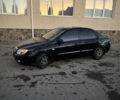 Чорний Кіа Черато, об'ємом двигуна 1.6 л та пробігом 197 тис. км за 5500 $, фото 6 на Automoto.ua