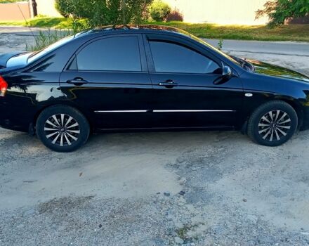 Чорний Кіа Черато, об'ємом двигуна 2 л та пробігом 203 тис. км за 5500 $, фото 2 на Automoto.ua