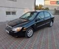 Черный Киа Черато, объемом двигателя 1.6 л и пробегом 208 тыс. км за 3900 $, фото 1 на Automoto.ua