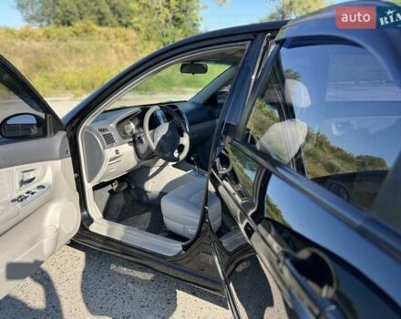 Чорний Кіа Черато, об'ємом двигуна 1.98 л та пробігом 163 тис. км за 5500 $, фото 4 на Automoto.ua