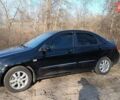 Черный Киа Черато, объемом двигателя 1.98 л и пробегом 174 тыс. км за 5900 $, фото 1 на Automoto.ua