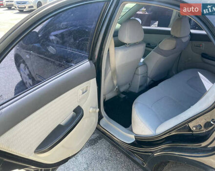 Черный Киа Черато, объемом двигателя 1.59 л и пробегом 210 тыс. км за 4100 $, фото 11 на Automoto.ua