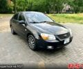 Черный Киа Черато, объемом двигателя 1.6 л и пробегом 187 тыс. км за 4999 $, фото 1 на Automoto.ua