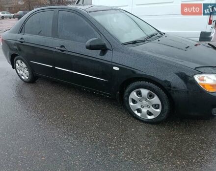 Черный Киа Черато, объемом двигателя 1.6 л и пробегом 260 тыс. км за 5200 $, фото 1 на Automoto.ua