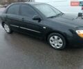 Черный Киа Черато, объемом двигателя 1.6 л и пробегом 260 тыс. км за 5200 $, фото 1 на Automoto.ua