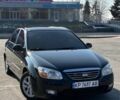 Черный Киа Черато, объемом двигателя 1.6 л и пробегом 247 тыс. км за 5100 $, фото 1 на Automoto.ua