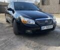 Чорний Кіа Черато, об'ємом двигуна 1.6 л та пробігом 157 тис. км за 5800 $, фото 2 на Automoto.ua