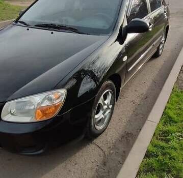 Черный Киа Черато, объемом двигателя 1.59 л и пробегом 273 тыс. км за 4200 $, фото 4 на Automoto.ua