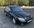 Чорний Кіа Черато, об'ємом двигуна 2 л та пробігом 310 тис. км за 3400 $, фото 2 на Automoto.ua
