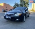 Черный Киа Черато, объемом двигателя 1.98 л и пробегом 335 тыс. км за 4100 $, фото 1 на Automoto.ua