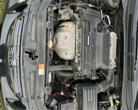 Черный Киа Черато, объемом двигателя 1.98 л и пробегом 315 тыс. км за 5745 $, фото 11 на Automoto.ua