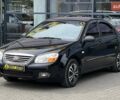 Чорний Кіа Черато, об'ємом двигуна 1.6 л та пробігом 190 тис. км за 4600 $, фото 2 на Automoto.ua
