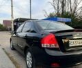 Черный Киа Черато, объемом двигателя 2 л и пробегом 186 тыс. км за 5300 $, фото 1 на Automoto.ua