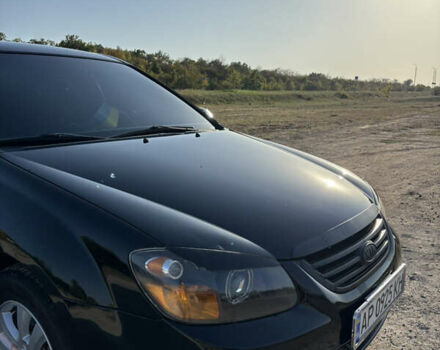 Черный Киа Черато, объемом двигателя 1.59 л и пробегом 314 тыс. км за 5000 $, фото 1 на Automoto.ua