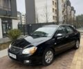 Черный Киа Черато, объемом двигателя 1.6 л и пробегом 256 тыс. км за 4200 $, фото 1 на Automoto.ua