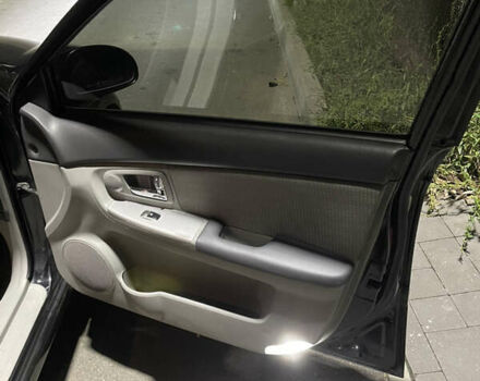 Черный Киа Черато, объемом двигателя 1.98 л и пробегом 315 тыс. км за 5745 $, фото 16 на Automoto.ua