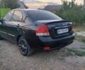 Черный Киа Черато, объемом двигателя 2 л и пробегом 290 тыс. км за 3600 $, фото 2 на Automoto.ua