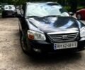 Черный Киа Черато, объемом двигателя 2 л и пробегом 163 тыс. км за 3000 $, фото 1 на Automoto.ua