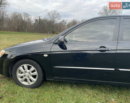 Черный Киа Черато, объемом двигателя 1.98 л и пробегом 315 тыс. км за 5745 $, фото 1 на Automoto.ua