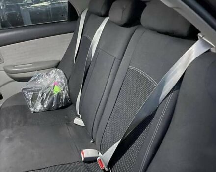 Черный Киа Черато, объемом двигателя 1.59 л и пробегом 273 тыс. км за 4200 $, фото 9 на Automoto.ua