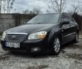 Черный Киа Черато, объемом двигателя 2 л и пробегом 220 тыс. км за 4700 $, фото 1 на Automoto.ua