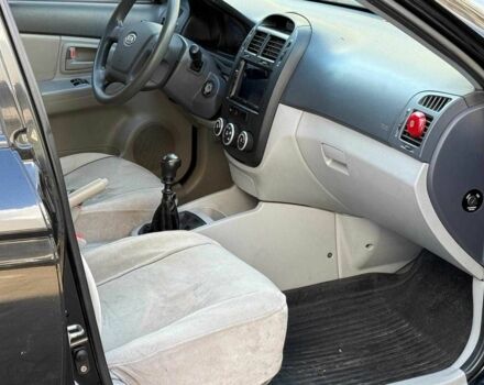 Черный Киа Черато, объемом двигателя 1.6 л и пробегом 239 тыс. км за 5140 $, фото 12 на Automoto.ua