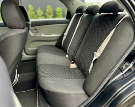 Чорний Кіа Черато, об'ємом двигуна 2 л та пробігом 270 тис. км за 4000 $, фото 9 на Automoto.ua