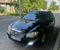 Черный Киа Черато, объемом двигателя 1.98 л и пробегом 270 тыс. км за 5200 $, фото 1 на Automoto.ua
