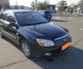 Чорний Кіа Черато, об'ємом двигуна 1.6 л та пробігом 190 тис. км за 6700 $, фото 1 на Automoto.ua