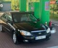 Чорний Кіа Черато, об'ємом двигуна 2 л та пробігом 310 тис. км за 4500 $, фото 1 на Automoto.ua