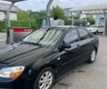 Черный Киа Черато, объемом двигателя 1.6 л и пробегом 245 тыс. км за 4499 $, фото 1 на Automoto.ua