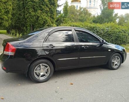 Чорний Кіа Черато, об'ємом двигуна 1.6 л та пробігом 200 тис. км за 4500 $, фото 7 на Automoto.ua