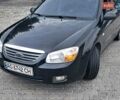 Черный Киа Черато, объемом двигателя 1.6 л и пробегом 185 тыс. км за 4000 $, фото 1 на Automoto.ua