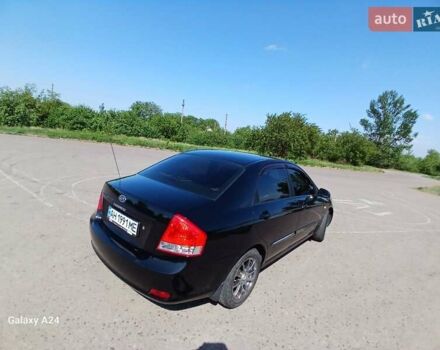 Черный Киа Черато, объемом двигателя 1.6 л и пробегом 225 тыс. км за 5200 $, фото 5 на Automoto.ua