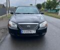 Чорний Кіа Черато, об'ємом двигуна 1.6 л та пробігом 254 тис. км за 3210 $, фото 1 на Automoto.ua
