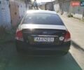 Черный Киа Черато, объемом двигателя 1.98 л и пробегом 181 тыс. км за 6000 $, фото 1 на Automoto.ua
