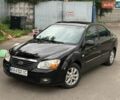 Черный Киа Черато, объемом двигателя 1.98 л и пробегом 310 тыс. км за 4550 $, фото 1 на Automoto.ua