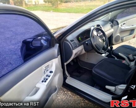 Черный Киа Черато, объемом двигателя 1.6 л и пробегом 272 тыс. км за 4700 $, фото 2 на Automoto.ua