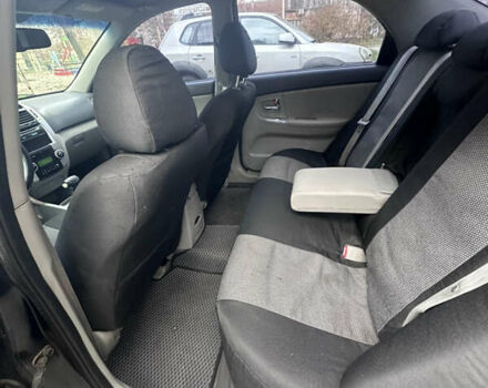 Черный Киа Черато, объемом двигателя 2 л и пробегом 220 тыс. км за 3400 $, фото 3 на Automoto.ua