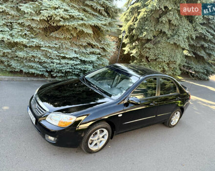 Черный Киа Черато, объемом двигателя 2 л и пробегом 110 тыс. км за 6300 $, фото 2 на Automoto.ua